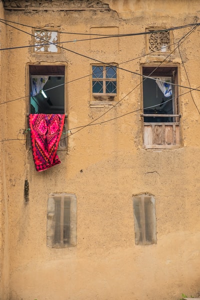 Red cloth hung in the window
